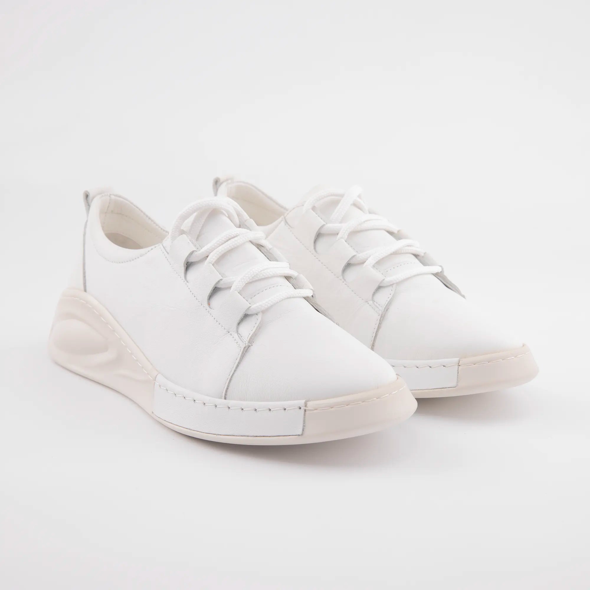 MrCalvano Carmel white leather women's sneakers with sculpted off-white soles, photographed on a clean background for detail.