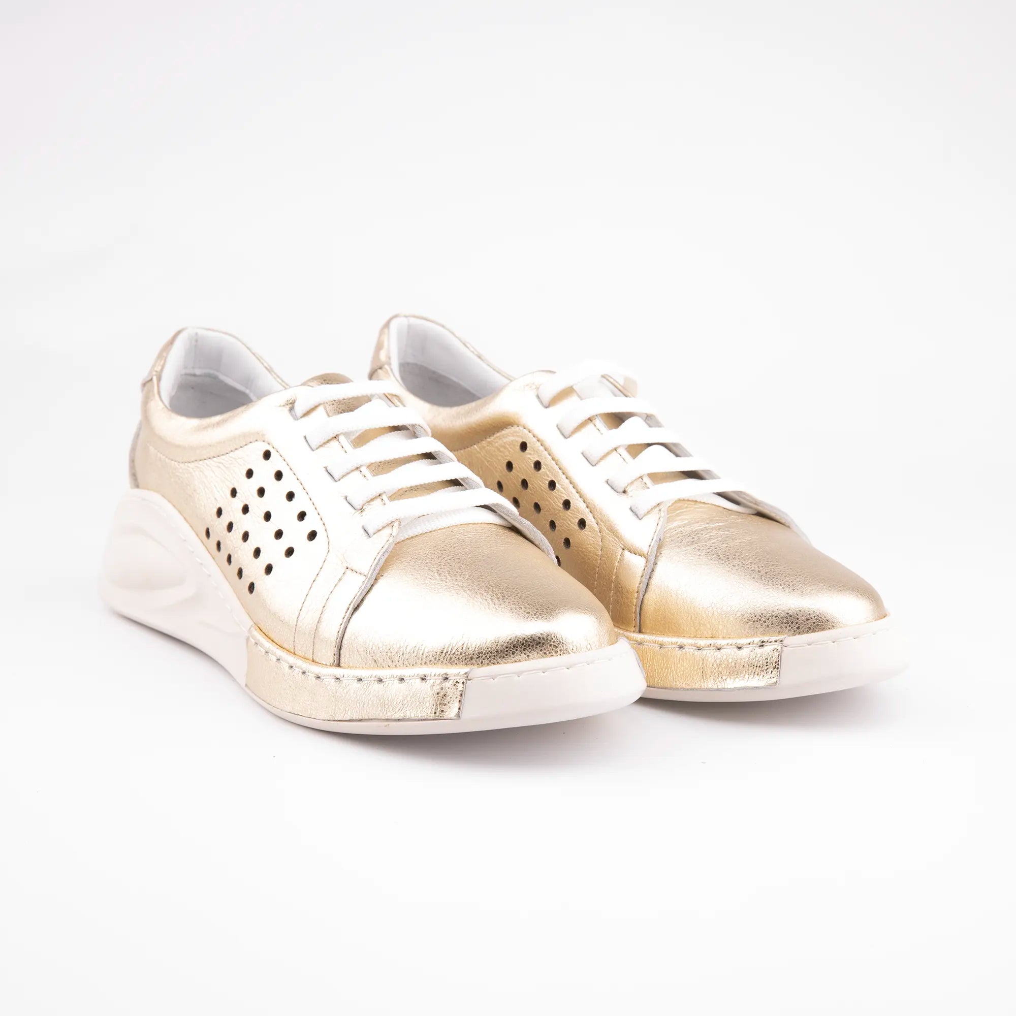 Pair of MrCalvano Laguna Beach comfort gold leather shoes with white laces and perforated side panels.