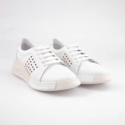 A pair of MrCalvano Laguna Beach white leather comfort shoes with perforated sides and a subtle wedge heel, angled slightly to show the textured sole.