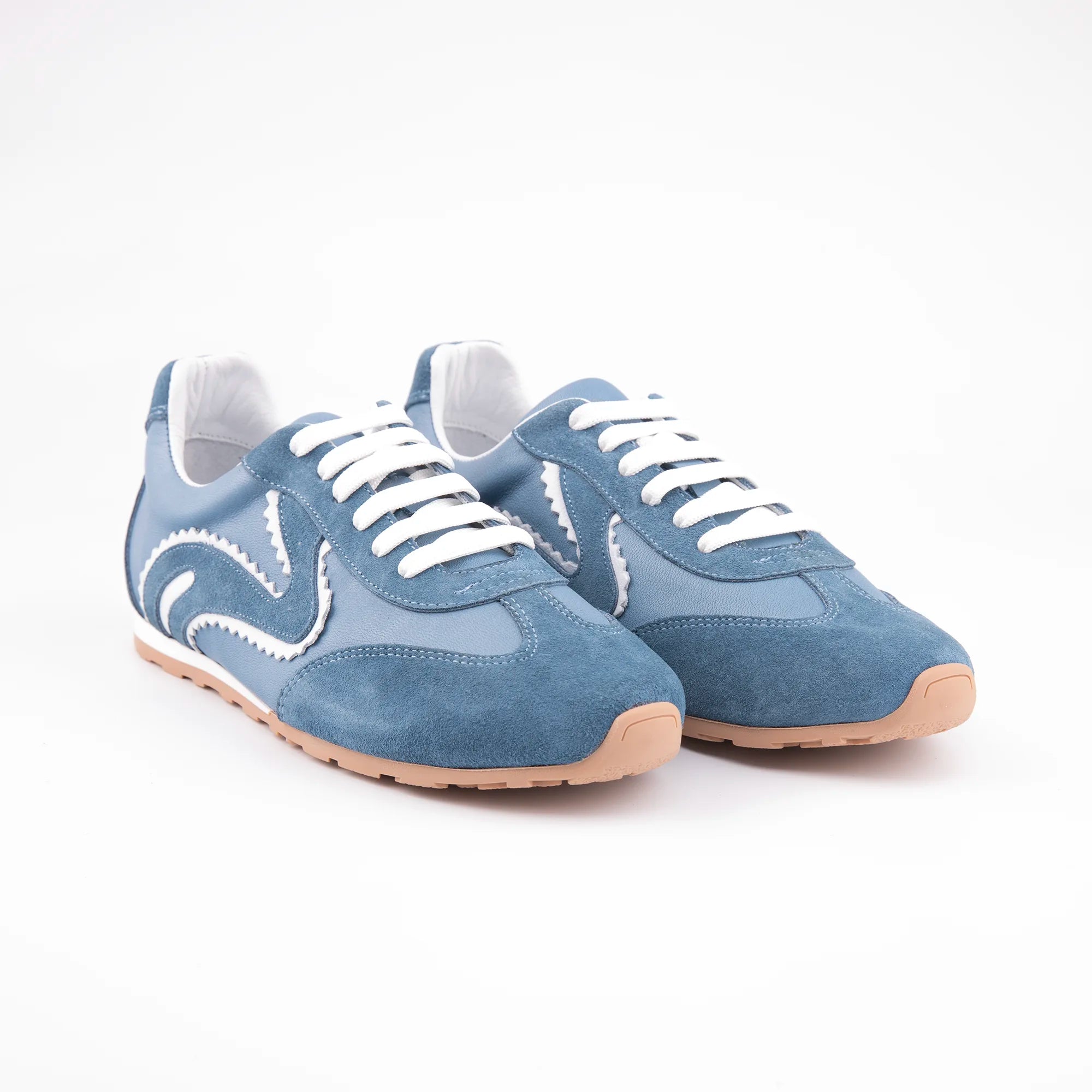 MrCalvano women's azure blue leather and suede retro sneakers with distinctive white wavy trim, white laces, and gum sole on a white background, side profile.