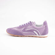 MrCalvano women's lavender leather and suede sneakers with white wavy details and gum sole, inner-facing on white background.