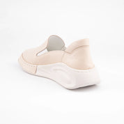 Calvano Malibu women's tan leather comfort sneakers with perforated upper and creamy off-white sculpted sole, back view.