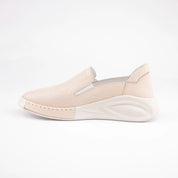 Calvano Malibu women's tan leather comfort sneakers with perforated upper and creamy off-white sculpted sole, inner side view.