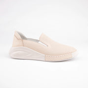 Calvano Malibu women's tan leather comfort sneakers with perforated upper and creamy off-white sculpted sole, outer side view.