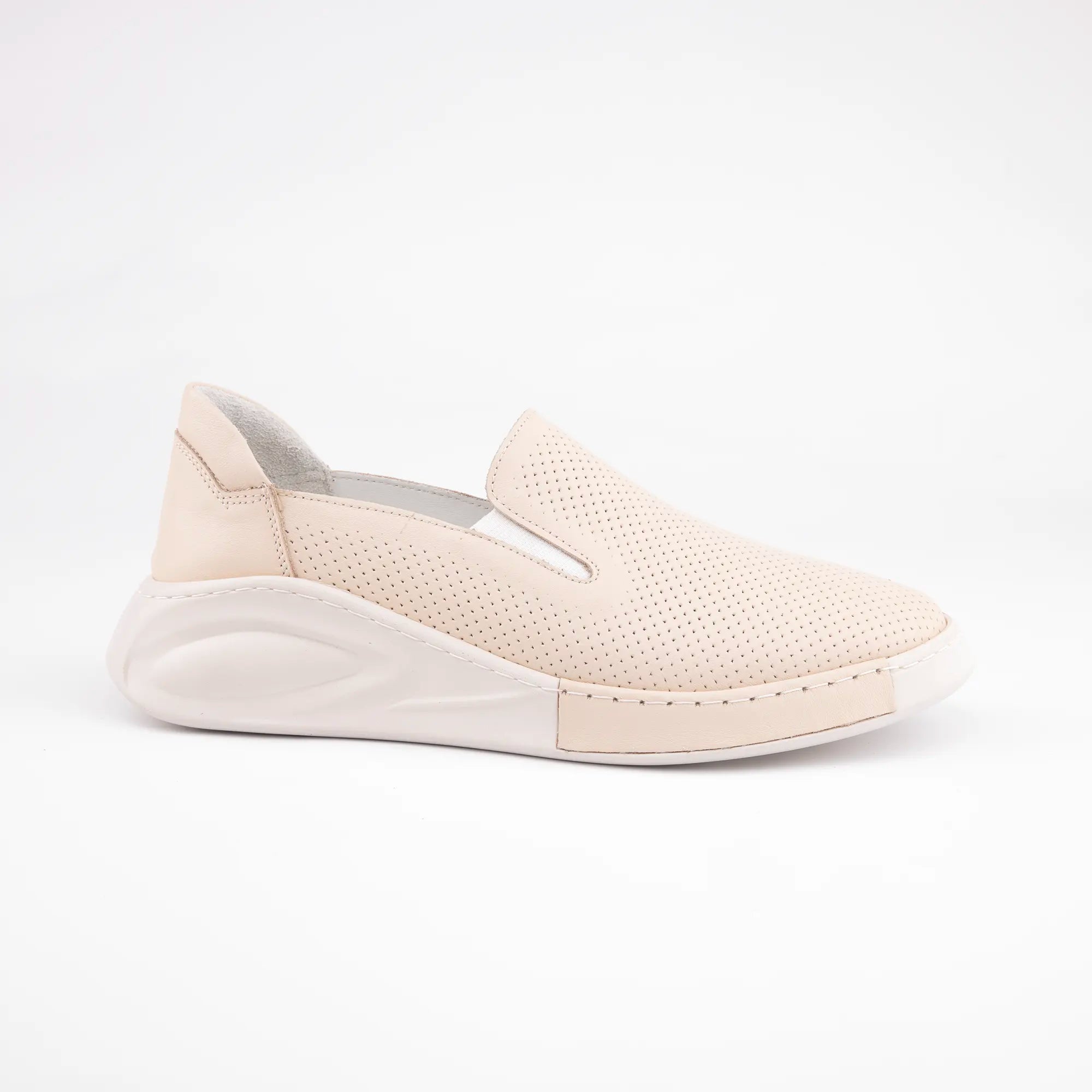 Calvano Malibu women's tan leather comfort sneakers with perforated upper and creamy off-white sculpted sole, outer side view.