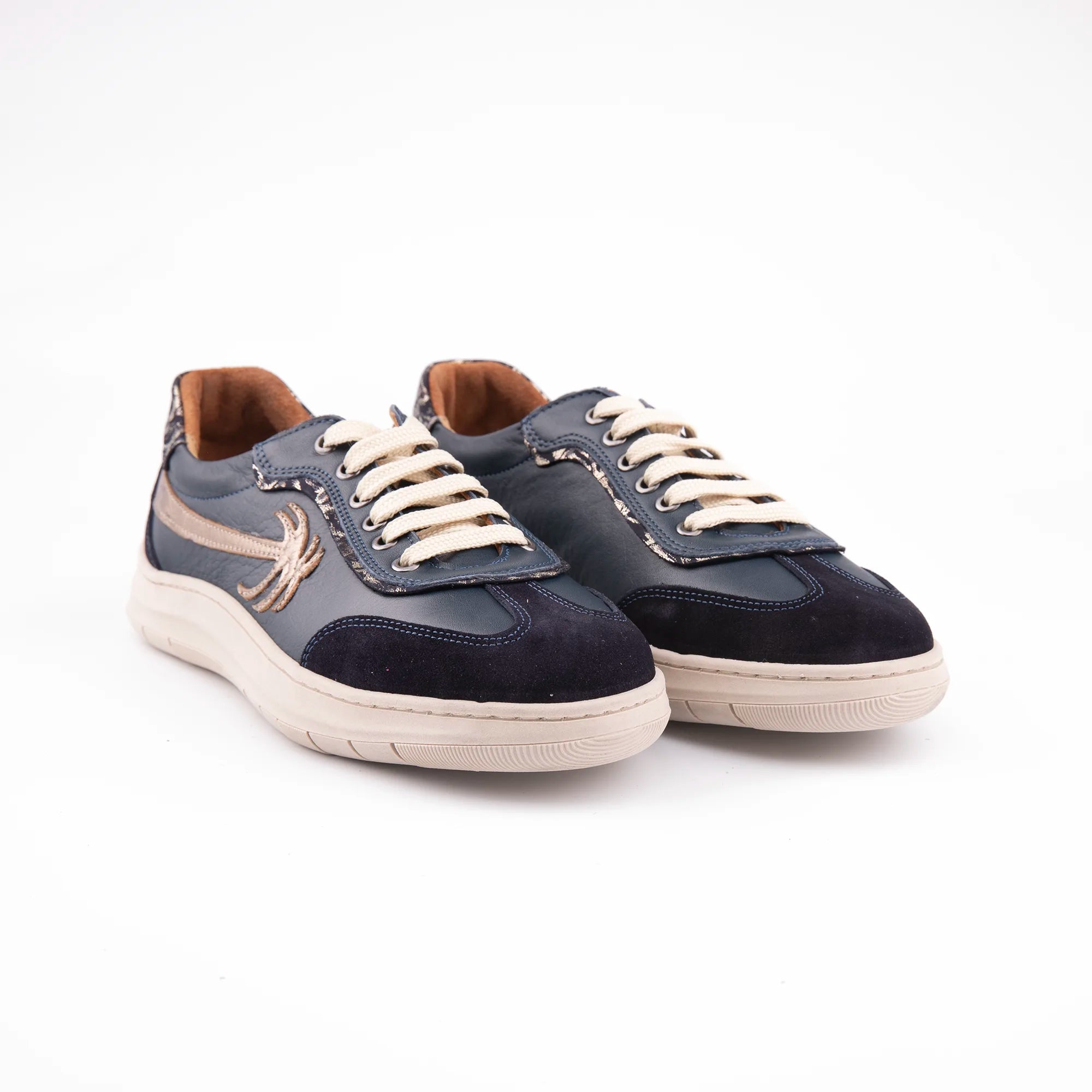 Full-body shot of MrCalvano Palm Springs navy leather women's shoes, highlighting the smooth leather, cream laces, and subtle metallic side detail on a clean white backdrop, emphasizing the shoe's pristine condition and design. united state