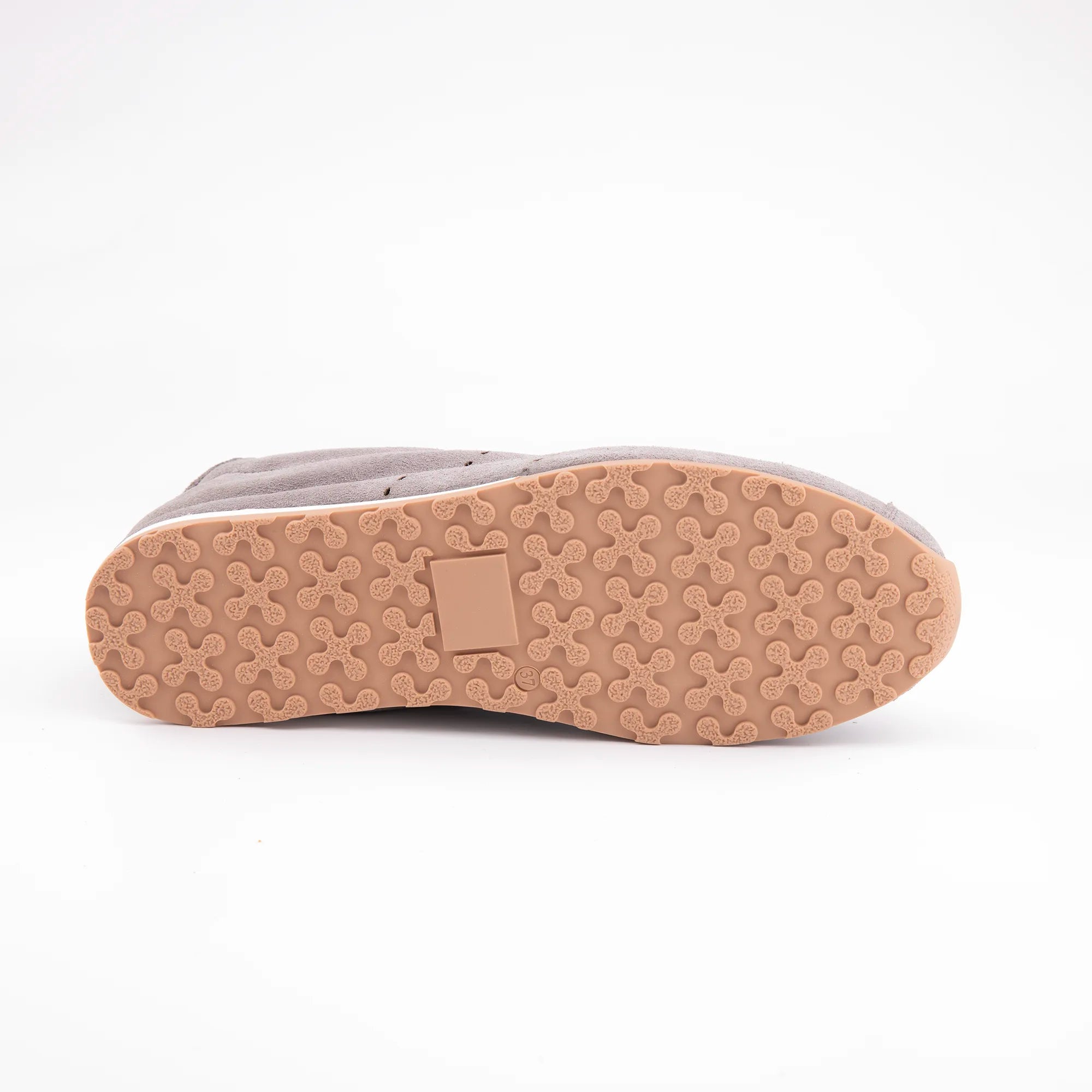 Showcasing the MrCalvano Pismo Beach Grey leather sneakers for women, this unique bottom-up perspective prominently features their durable, light tan rubber outsole with