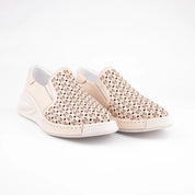 A pair of MrCalvano Solana Beach Tan perforated leather slip-on shoes for women, featuring an off-white sole and subtle stitching, photographed on a clean white background.