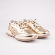 A single MrCalvano Venice Beach Gold Leather Women's Sneaker, shown on a white background, highlighting the metallic finish, perforated details, and unique sculpted sole design. Designed for casual comfort.