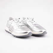 Front 3/4 view of MrCalvano Venice Silver Leather Women's Sneakers, showcasing the metallic tumbled leather upper, warm off-white midsole, and cool grey outsole on a clean white background.