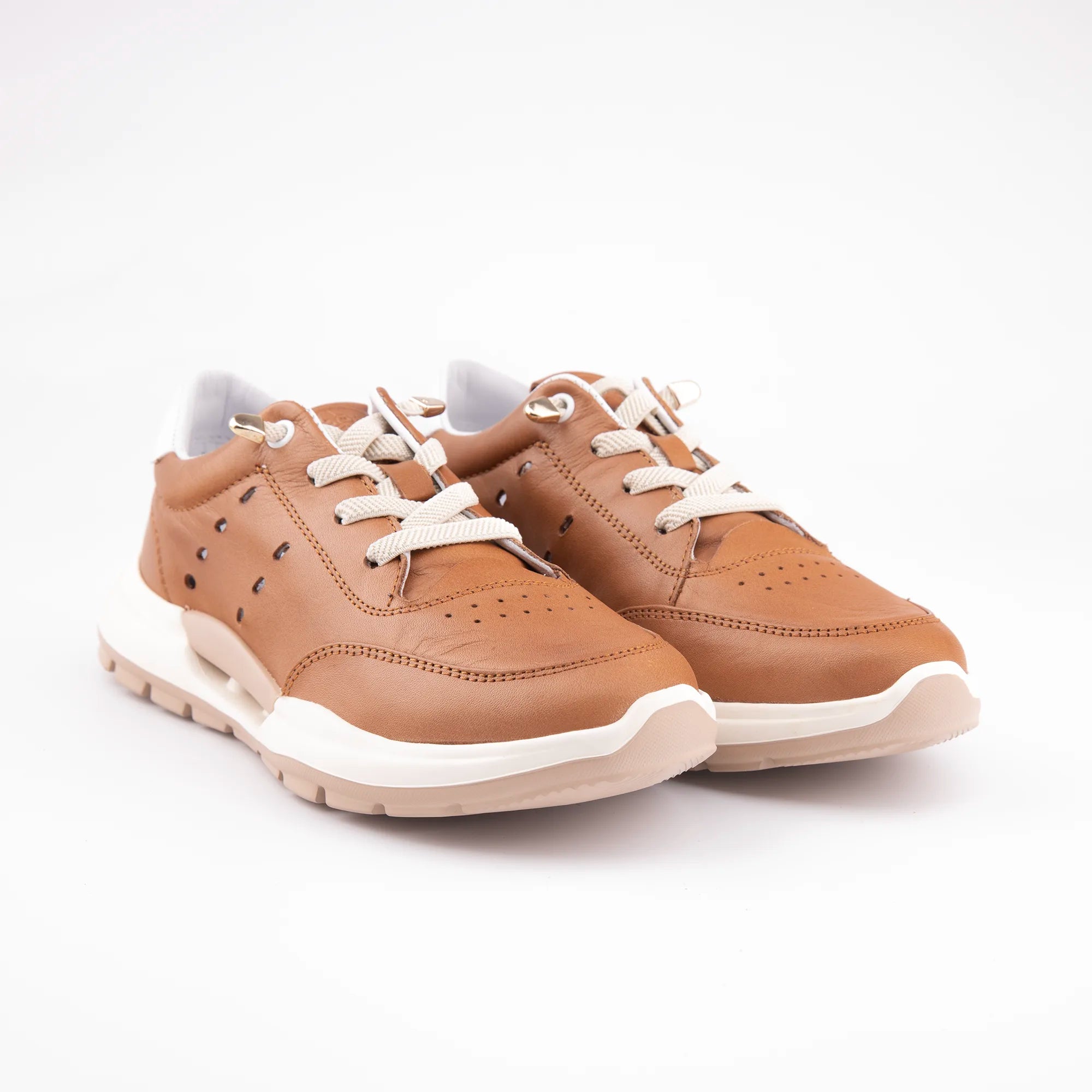 A pair of MrCalvano Venice women's sneakers, crafted from rich tobacco brown leather with off-white laces and a multi-layered sole, photographed in a clean studio setting, emphasizing the design for casual urban wear in the United State.